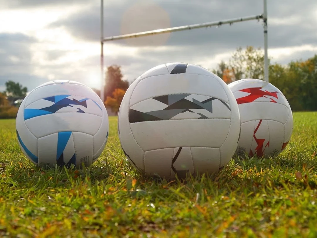 Close-up of Gaelic footballs showing panel construction and grip texture